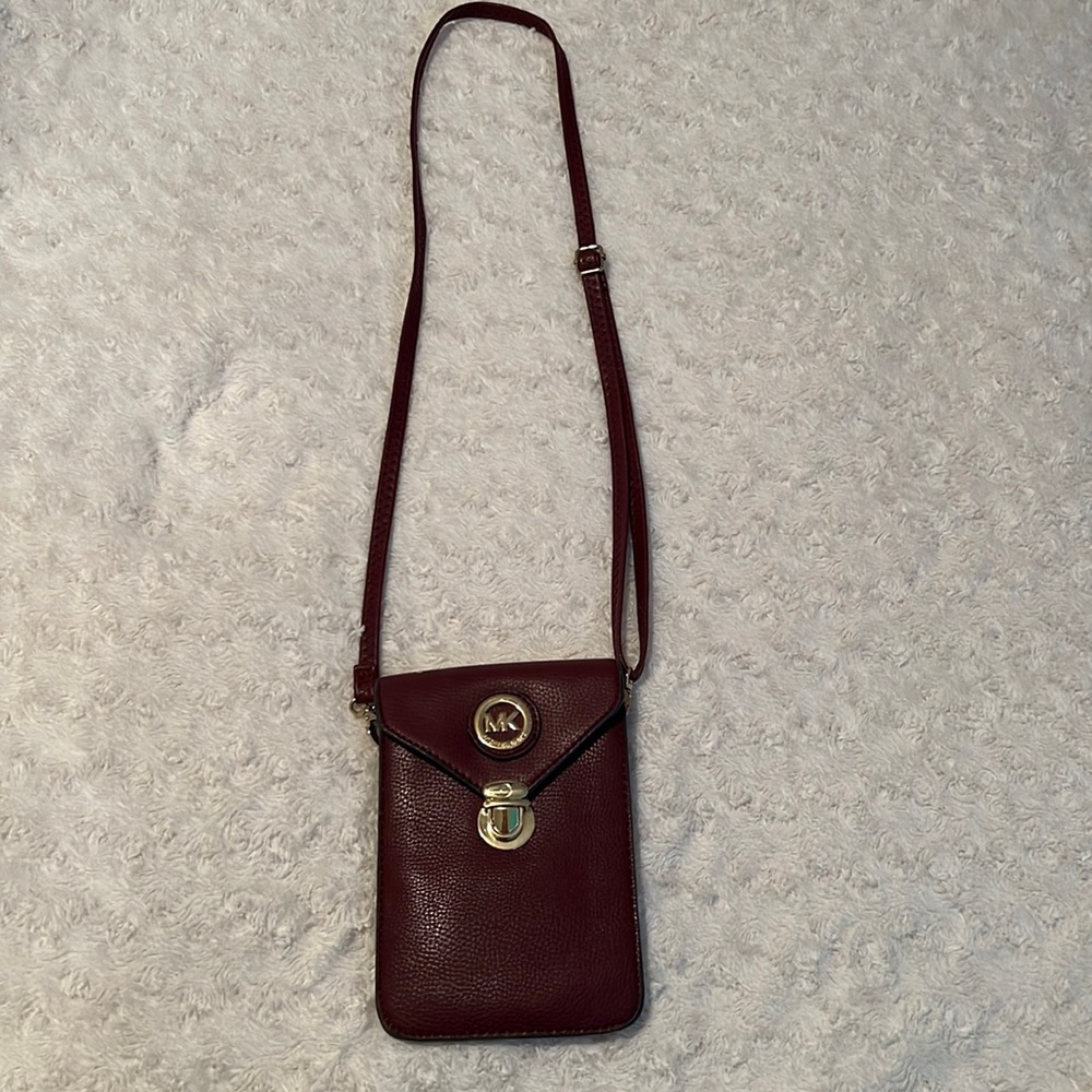 Burgundy Michael kors travel pouch with strap